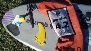 You'll need scissors and some film in addition to the fin and board.