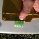 Cut the film to get a piece that wraps around the base of the fin.