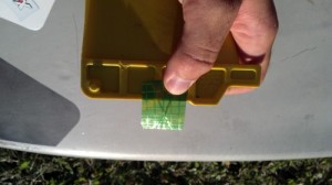 Cut the film to get a piece that wraps around the base of the fin.