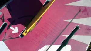 With the shim wrapped evenly around the base, push the fin in the board.