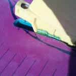 Push down on the fin gently but firmly.