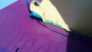 Push down on the fin gently but firmly.