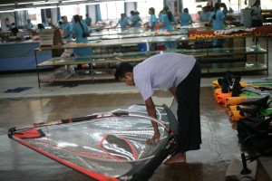 This is so important for the sails-- Jayalal checks every seam and panel.