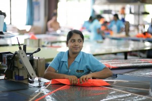 Lasanka sews the side stiching on a Panther panel.