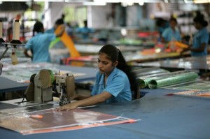 This worker is sowing a panel for a Panther.