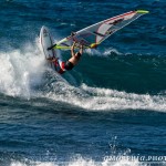 Kevin goes vertical on a small Hookipa wave