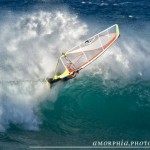 Off the lip with a cloud bursting of spray. Powder days at Hookipa!