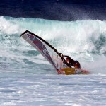 Cranking a bottom turn on a Hookipa swell.