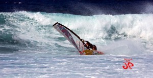 Cranking a bottom turn on a Hookipa swell.