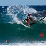 Throwing a taka for the photographers in the water.