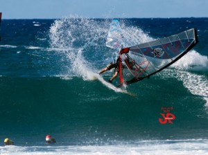 Throwing a taka for the photographers in the water.