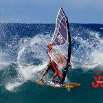 Hitting a cutback and letting the tail slide.