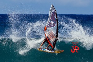 Hitting a cutback and letting the tail slide.