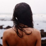 She looks out into the expanse of the sea-- and sees the sea look back at her.
