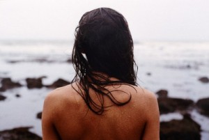 She looks out into the expanse of the sea-- and sees the sea look back at her.