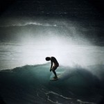 The working man rides a wave, baring his soul for all the sea to see.