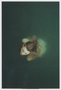 The Lady of the Lake waits, excalibur in hand, treading water, and bracing the cold.