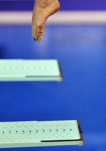 Point your toes, keep your legs together, and stay as close to the board as possible...but try not to land on it.