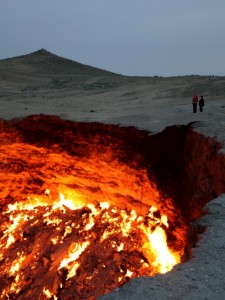 This is a pit of fire in Turkmenistan named "The Door to Hell". Even after some research, I couldn't quite find out a consistent history. But apparently it's been burning for at least 35 years due to the seeping natural gas. A mining accident possibly?