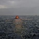 To be held by the ocean-- resting on her tummy and feeling her sweet kisses from above.