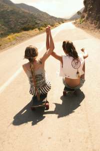Grab hold of each other and roll forward, sans breaks of course.